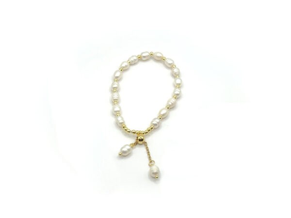La perla. Elegant pearl and gold stainless steel bracelet with elastic fit and delicate dangling pearl details. Ατσάλινο δαχτυλίδι, stainless steel bracelet, steinless steel jewelry