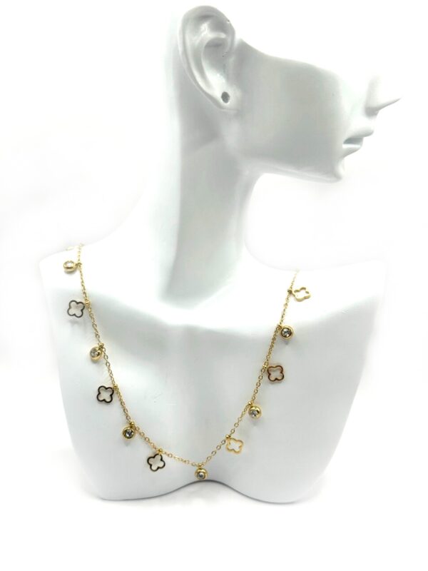 Gold stainless steel necklace with decorative elements and sparkling zircon stones. An elegant and timeless design for any occasion.